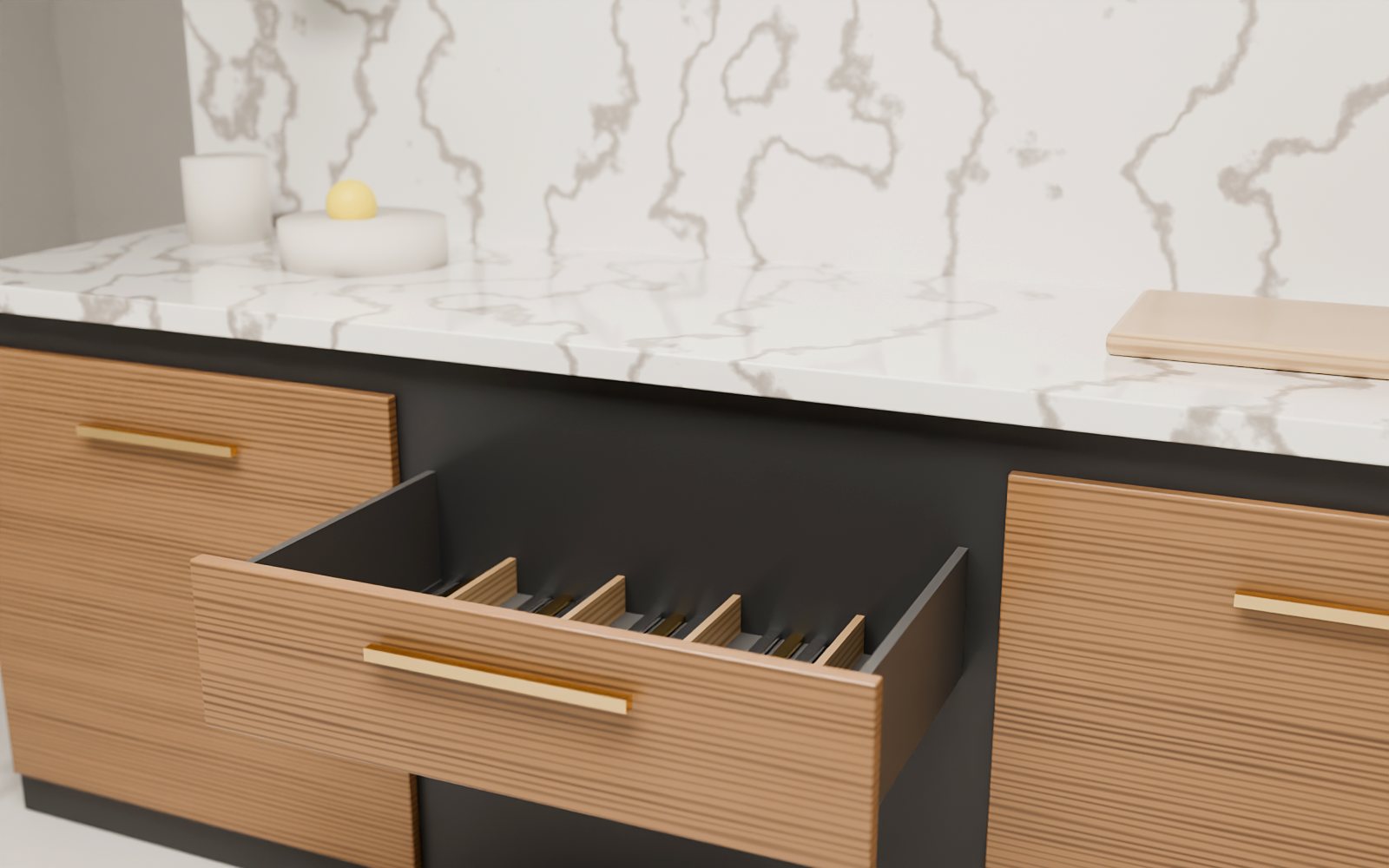 Walnut kitchen drawer with oak organiser and brass handle under a marble worktop, Dubai